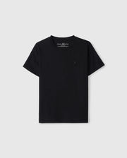 A plain black Psycho Bunny T-shirt against a white background. The KIDS EMBROIDERED CLASSIC TEE - B0U020AR00 features short sleeves and a small embroidered black rabbit logo on the left chest. The neckline is round, and the material, made from Peruvian Pima cotton, appears to be soft and comfortable—a truly timeless silhouette.