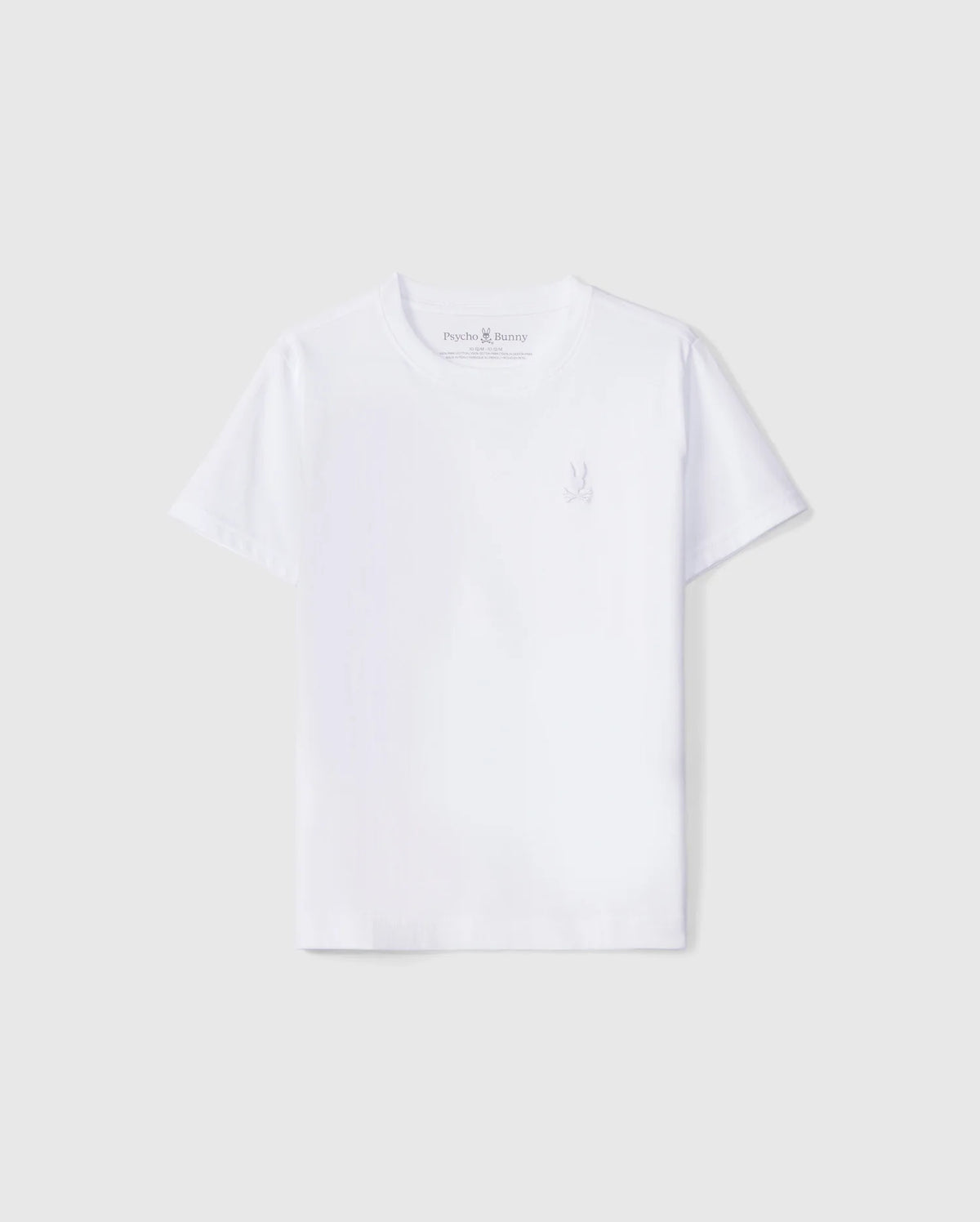 A plain white crew neck tee for kids, made from soft Peruvian Pima cotton with short sleeves. The KIDS EMBROIDERED CLASSIC TEE - B0U020AR00 features a subtle small embroidered Psycho Bunny logo on the left side of the chest. The background is a light grey.