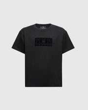 The KIDS ROMEO HEAVY WEIGHT RELAXED FIT TEE - B0U110E200 by Psycho Bunny is a children's black tee that showcases three minimalist bunny faces across the chest, crafted from soft Pima cotton for ultimate comfort and durability.