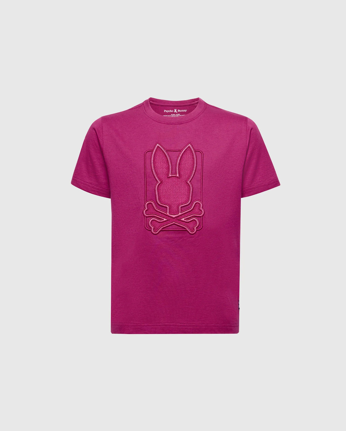 The KIDS PIERCE GRAPHIC TEE - B0U115E200 from Psycho Bunny is a magenta Pima cotton t-shirt for kids, showcasing a stylized bunny skull and crossbones emblem embroidered on the chest. The striking design pops vividly against a plain white backdrop.