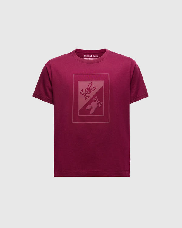 The Psycho Bunny Kids Dotser Printed Graphic Tee in maroon features a subtle bunny with a carrot on the front. Crafted from soft Peruvian Pima cotton, it includes a neck label reading "Purple & Reeny.