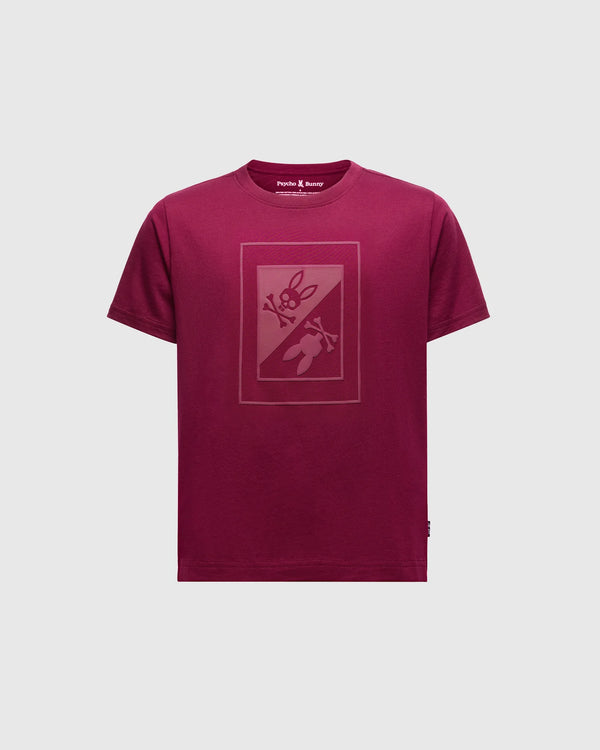 The Psycho Bunny Kids Dotser Printed Graphic Tee in maroon features a subtle bunny with a carrot on the front. Crafted from soft Peruvian Pima cotton, it includes a neck label reading "Purple & Reeny.