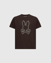 This Psycho Bunny KIDS MONARC FRONT BUNNY GRAPHIC TEE - B0U211E200 showcases a black T-shirt design with a bunny head above crossed bones on the front, set against a plain white background—a stylish choice.