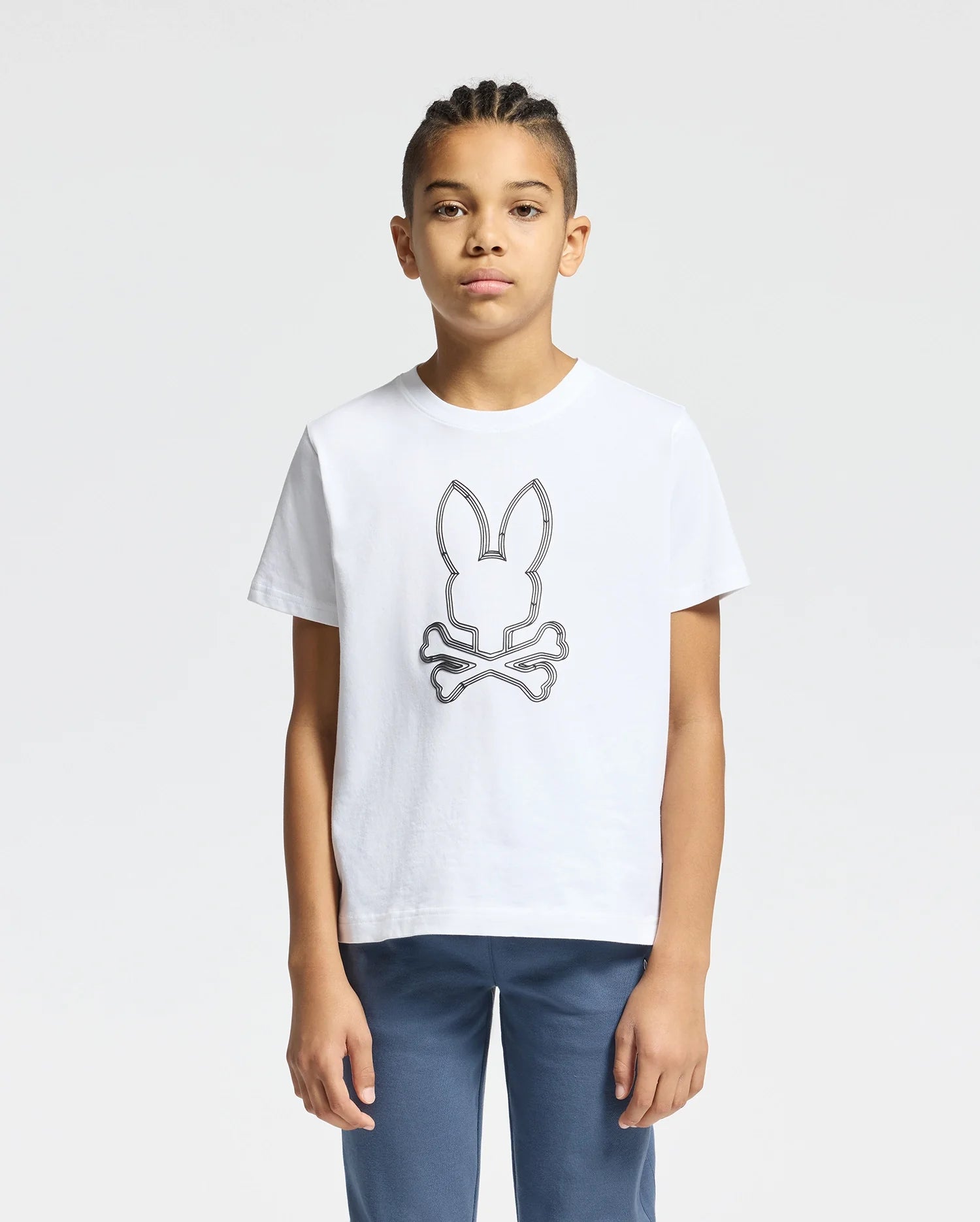 The image shows a white short-sleeved t-shirt with a black Psycho Bunny logo on the left chest.