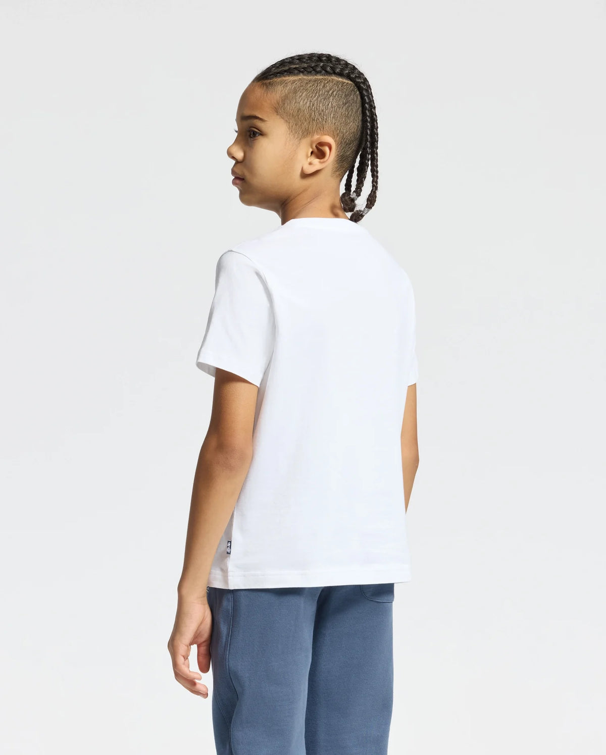 The image shows a white short-sleeved t-shirt with a black Psycho Bunny logo on the left chest.