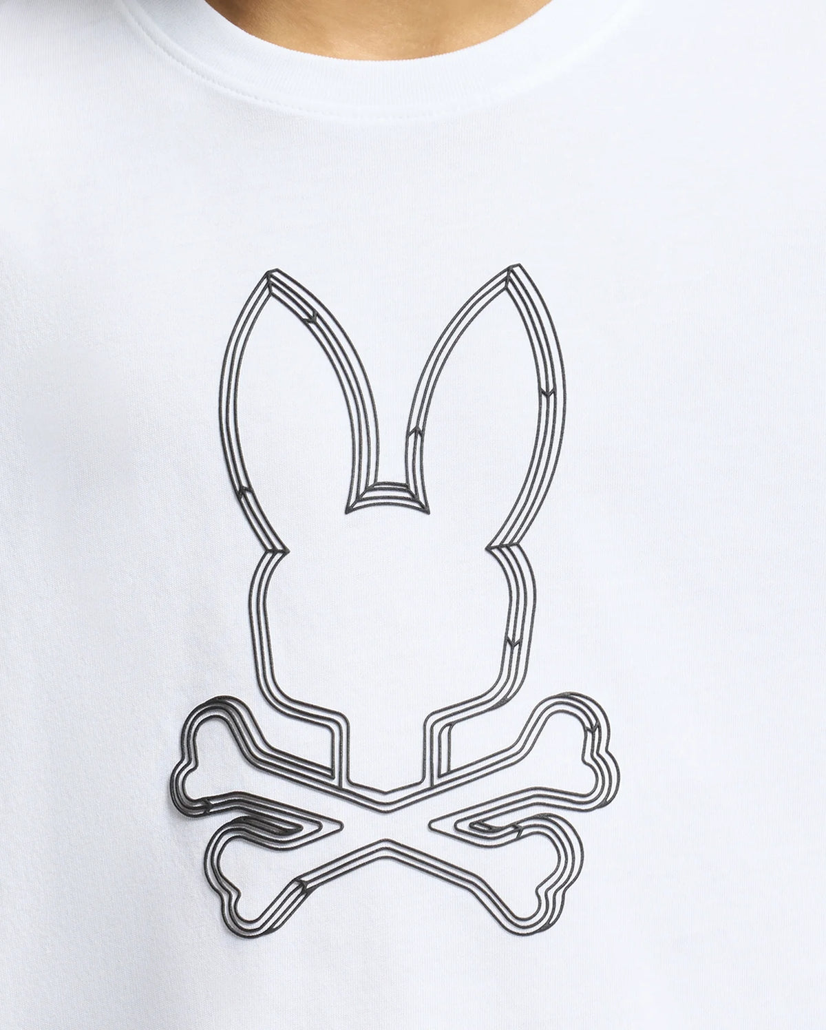 The image shows a white short-sleeved t-shirt with a black Psycho Bunny logo on the left chest.