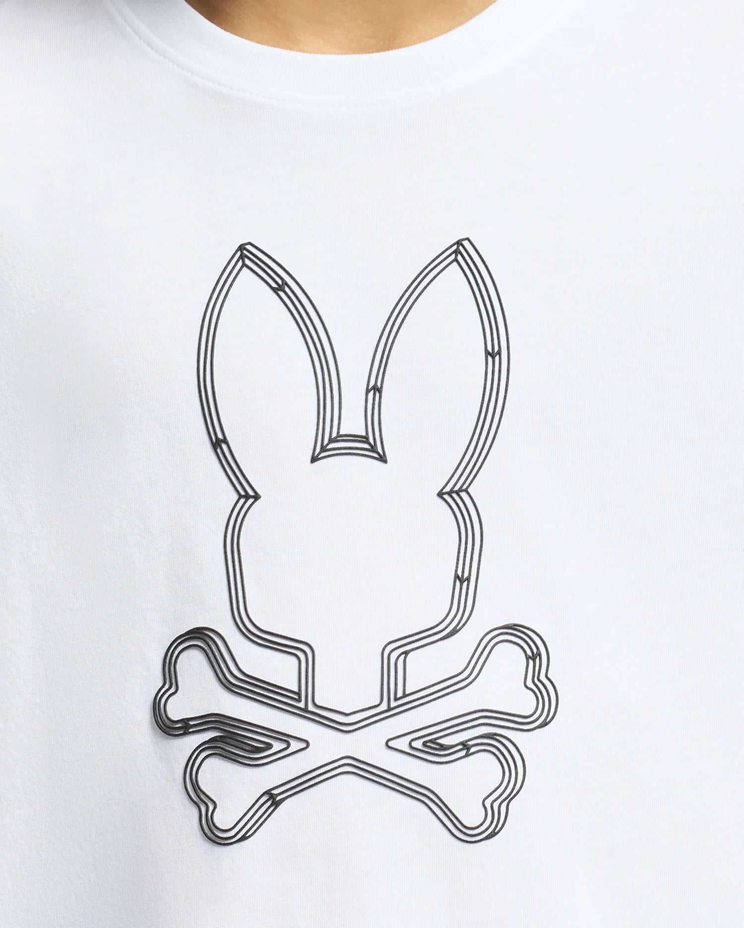 The image shows a white short-sleeved t-shirt with a black Psycho Bunny logo on the left chest.
