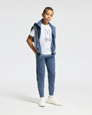 The image shows a white short-sleeved t-shirt with a black Psycho Bunny logo on the left chest.