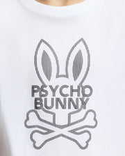 The KIDS DUMON GRAPHIC TEE by Psycho Bunny, made from soft Pima cotton, features a stylish white T-shirt design with an abstract rabbit head logo, elongated ears above crossed bones, and the bold text "Psycho Bunny" beneath.