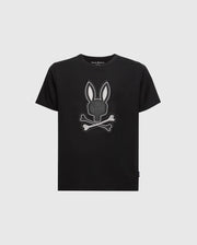 The KIDS NEW CASTLE GRAPHIC TEE by Psycho Bunny (B0U415F200) is a black T-shirt made of premium Pima cotton. It features an embroidered bunny head with long ears above two crossed bones, outlined in white, resembling a skull and crossbones design.