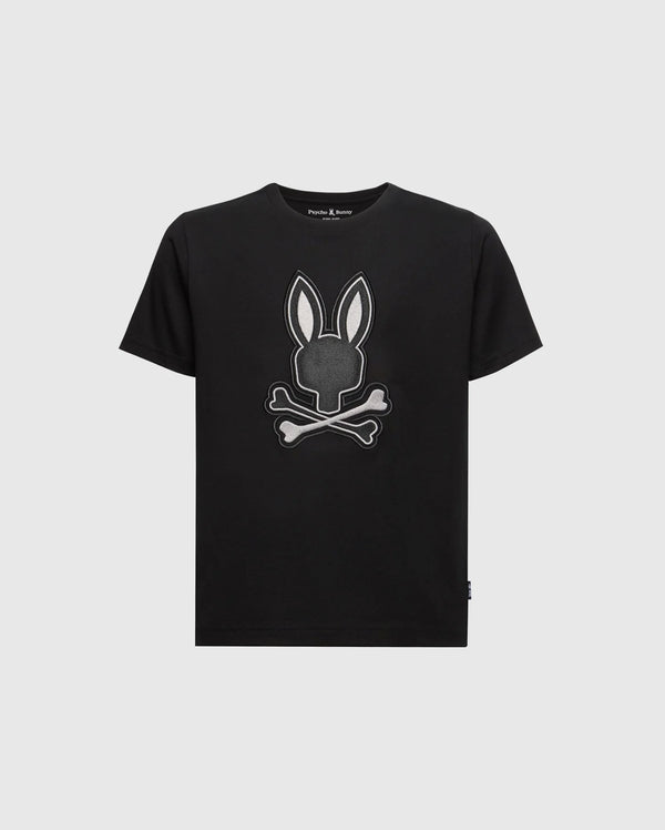 The KIDS NEW CASTLE GRAPHIC TEE by Psycho Bunny (B0U415F200) is a black T-shirt made of premium Pima cotton. It features an embroidered bunny head with long ears above two crossed bones, outlined in white, resembling a skull and crossbones design.