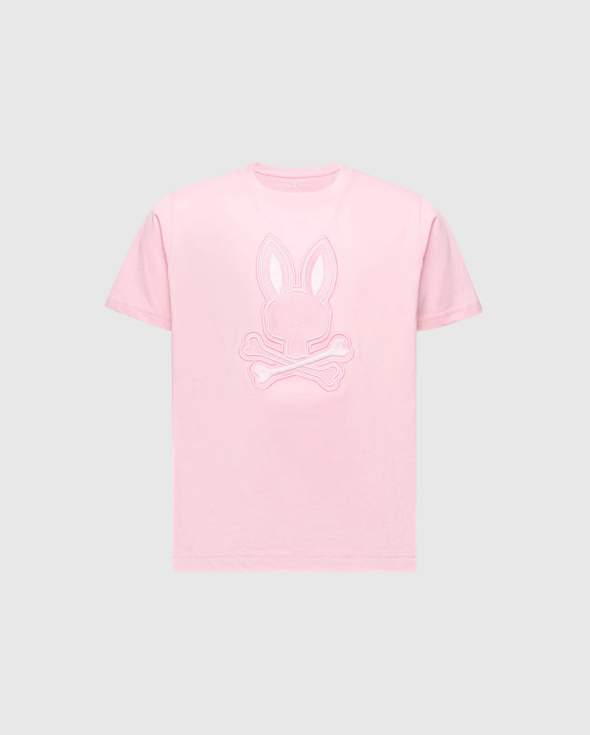 The Psycho Bunny KIDS NEW CASTLE EMBROIDERED GRAPHIC TEE (B0U415F200) features a pink embroidered Bunny head and crossed bones on a light grey background, made from soft Pima cotton for comfort.