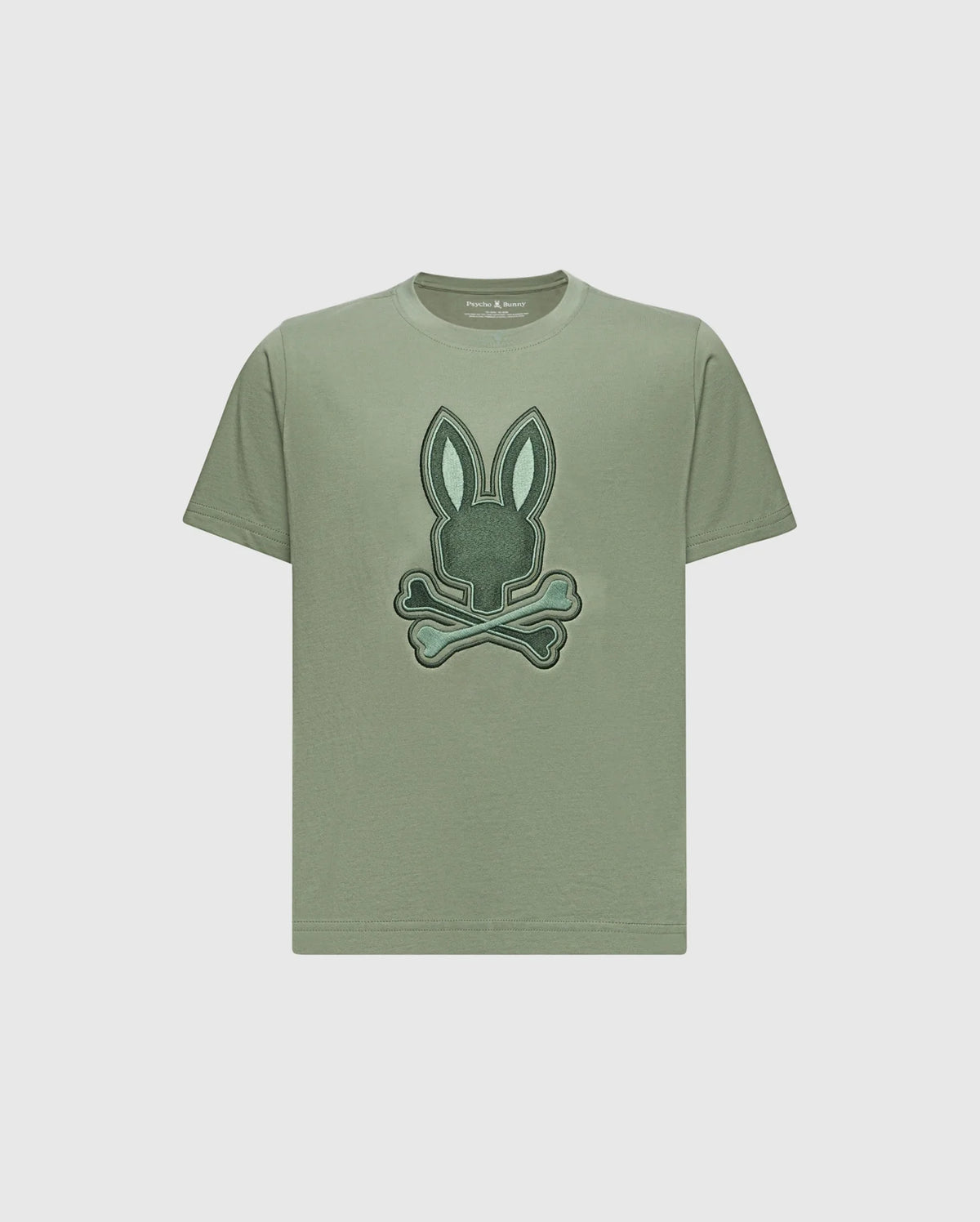 The KIDS NEW CASTLE EMBROIDERED GRAPHIC TEE by Psycho Bunny is a khaki Pima cotton t-shirt with a two-tone bunny graphic—rabbit head above crossed bones—embroidered on the front.