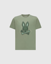 The KIDS NEW CASTLE EMBROIDERED GRAPHIC TEE by Psycho Bunny is a khaki Pima cotton t-shirt with a two-tone bunny graphic—rabbit head above crossed bones—embroidered on the front.