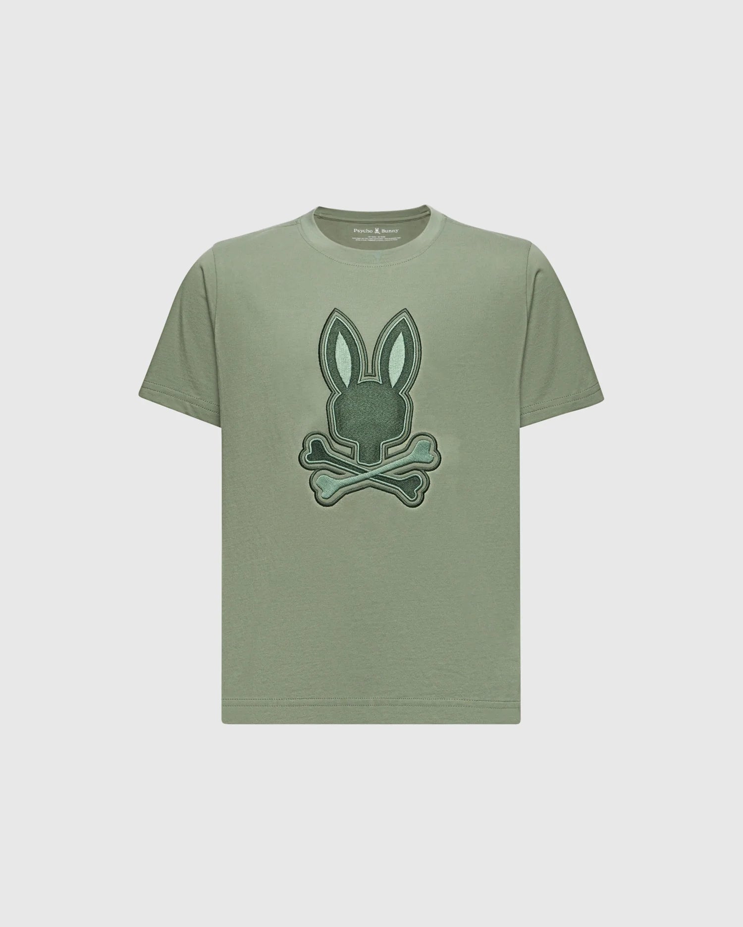 The KIDS NEW CASTLE EMBROIDERED GRAPHIC TEE by Psycho Bunny is a khaki Pima cotton t-shirt with a two-tone bunny graphic—rabbit head above crossed bones—embroidered on the front.