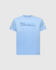 The KIDS BERNI EMBROIDERED WORDMARK GRAPHIC TEE (B0U417F200) by Psycho Bunny is a light blue Pima cotton shirt with "Psycho Bunny" in raised text and a small embroidered bunny logo. It features a rib knit crewneck, shown on a plain white background.