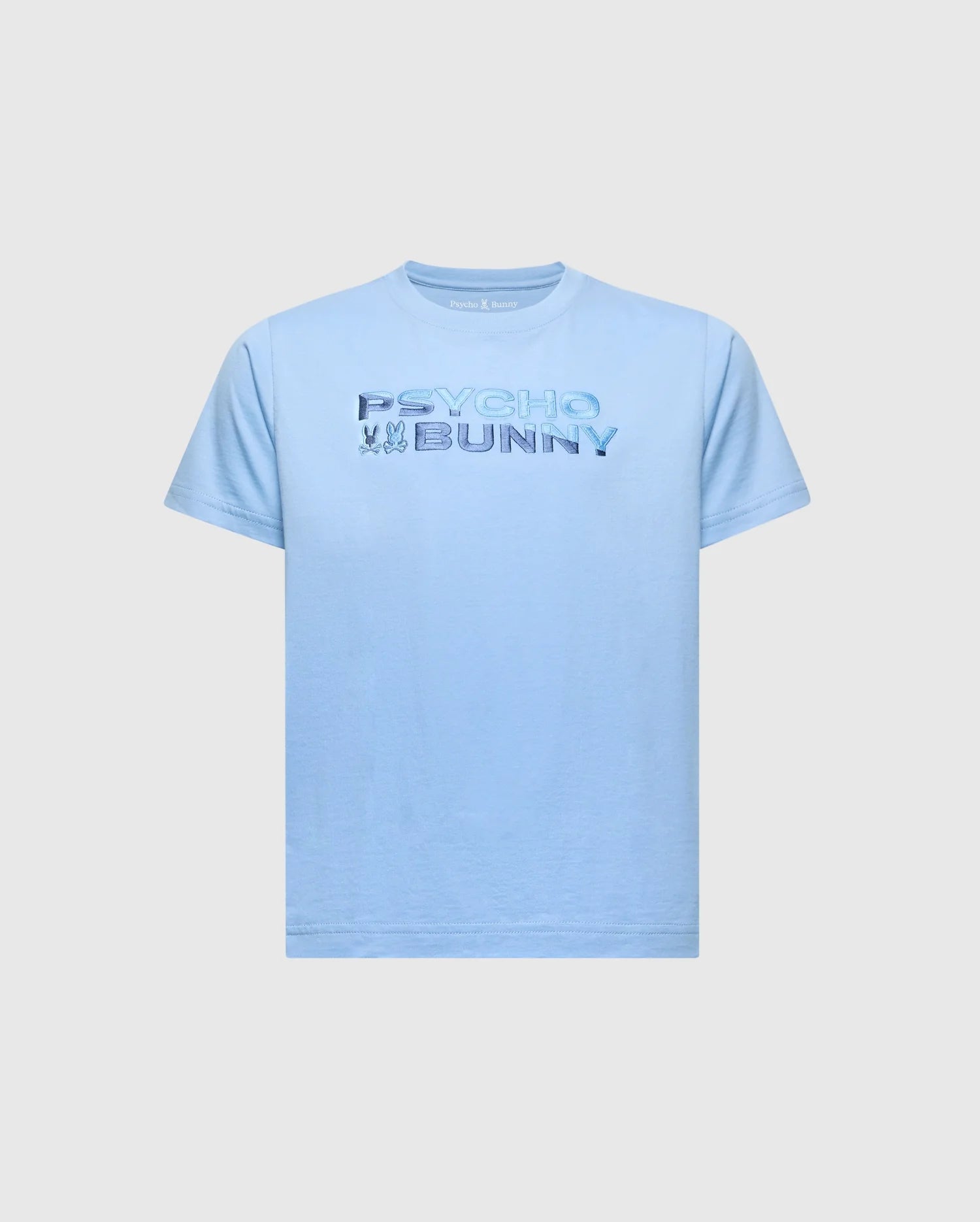 The KIDS BERNI EMBROIDERED WORDMARK GRAPHIC TEE (B0U417F200) by Psycho Bunny is a light blue Pima cotton shirt with "Psycho Bunny" in raised text and a small embroidered bunny logo. It features a rib knit crewneck, shown on a plain white background.