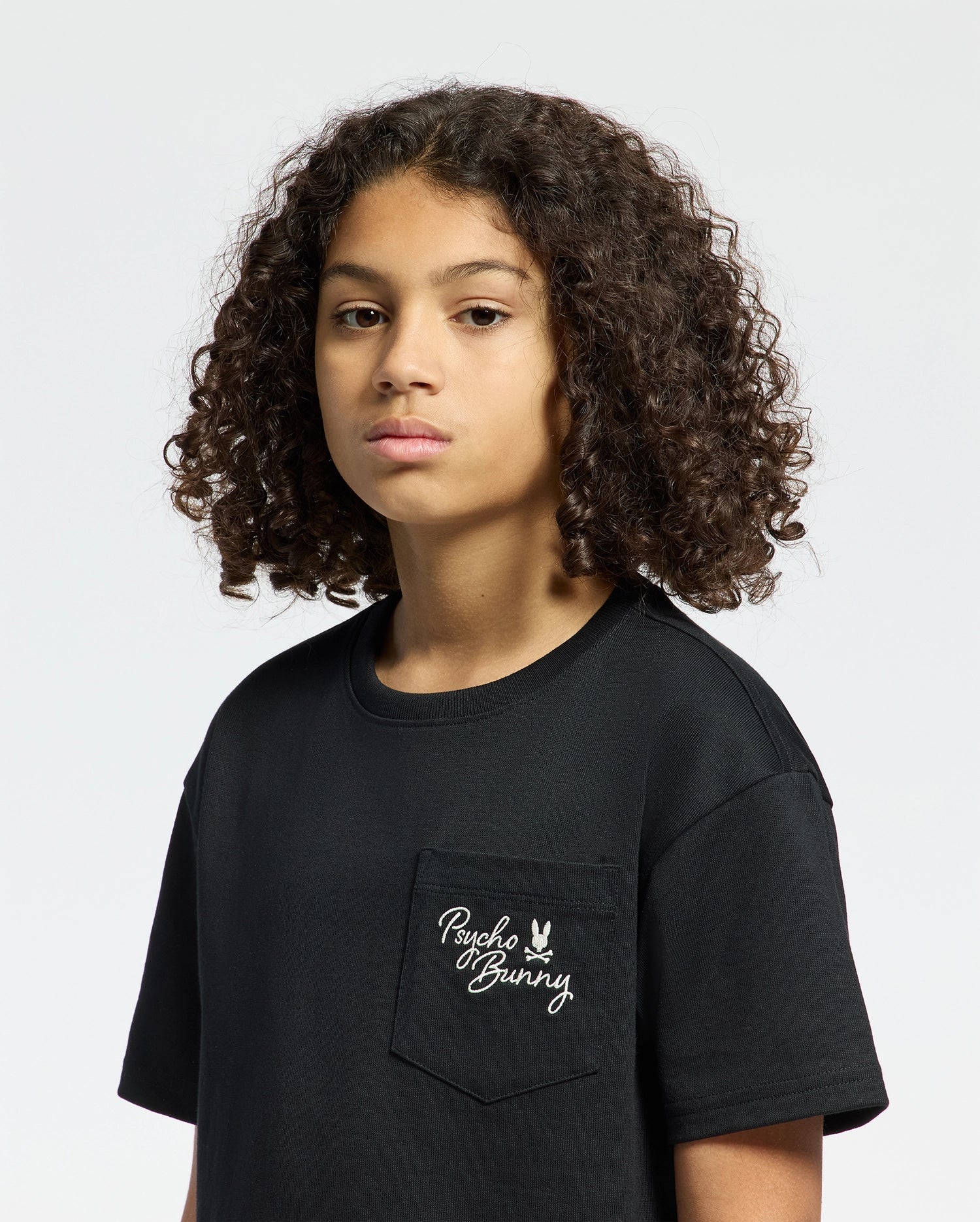 Kids | Kids' Desert Oversized Pocket Tee by Psycho Bunny, featuring a relaxed fit, chest pocket, and embroidered logo for a casual, stylish look.