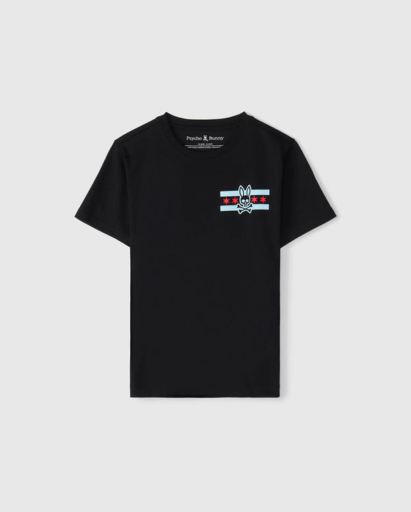 A black Pima cotton jersey T-shirt designed for kids, featuring a striking bunny skull logo on the chest, complemented by red stars and light blue stripes. With its "Psycho Bunny" label, it serves as the ideal Chicago tee to display a bold sense of style.