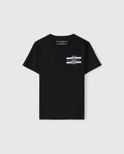 A black Pima cotton jersey T-shirt designed for kids, featuring a striking bunny skull logo on the chest, complemented by red stars and light blue stripes. With its "Psycho Bunny" label, it serves as the ideal Chicago tee to display a bold sense of style.