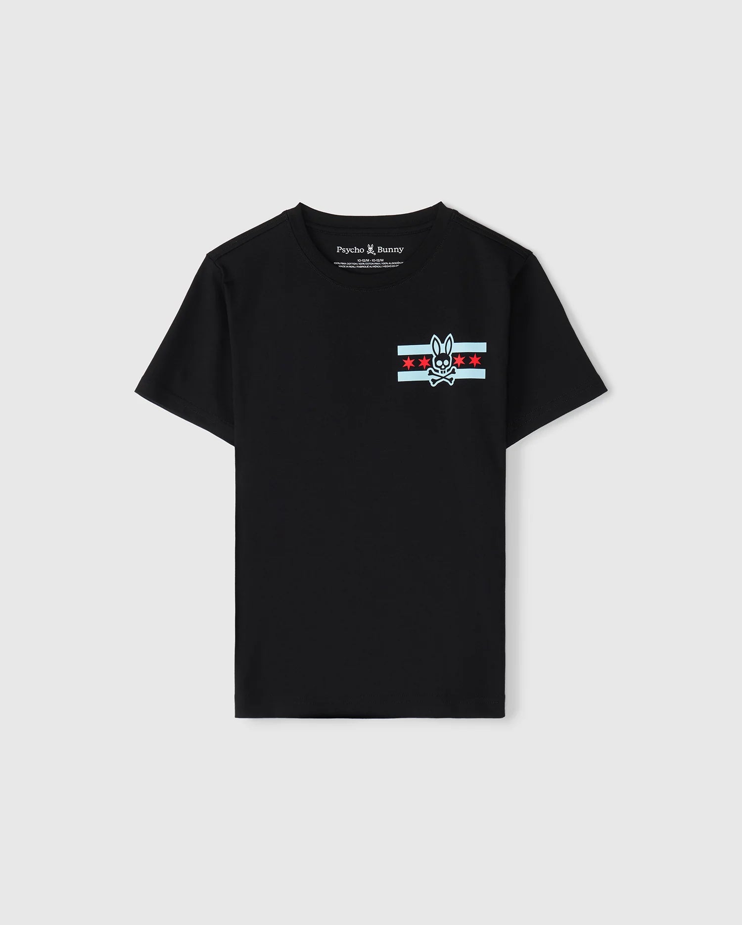 A black Pima cotton jersey T-shirt designed for kids, featuring a striking bunny skull logo on the chest, complemented by red stars and light blue stripes. With its "Psycho Bunny" label, it serves as the ideal Chicago tee to display a bold sense of style.