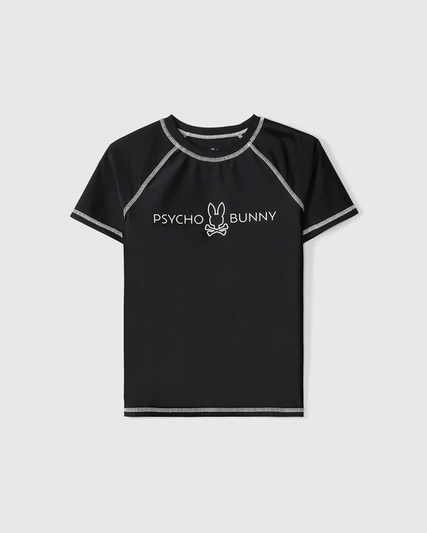A black, short sleeve rashguard with grey stitching. The shirt features the "Psycho Bunny" logo in white across the chest, complete with a bunny's head and bones underneath the text. Ideal for kids, it offers UPF 50+ protection. The product is called KIDS SHORT SLEEVE ANTI-UV RASHGUARD - B0U558C200 from Psycho Bunny.