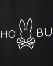 A black background features a white minimalist graphic of a bunny head with crossed bones, mimicking a skull and crossbones. The letters "HO" are partially visible to the left of the bunny, and "BU" to the right. This design is perfect for a Psycho Bunny KIDS SHORT SLEEVE ANTI-UV RASHGUARD - B0U558C200 offering UPF 50+ protection.