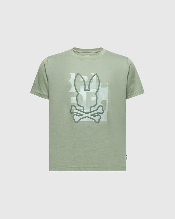 The KIDS ZEALAND GRAPHIC TEE - B0U604F200 by Psycho Bunny is a light green Pima cotton T-shirt with a big bunny logo with crossed bones on the front. It features subtle geometric shapes in lighter shades on a plain light gray background.