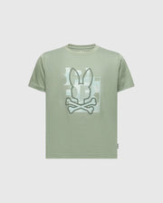 The KIDS ZEALAND GRAPHIC TEE - B0U604F200 by Psycho Bunny is a light green Pima cotton T-shirt with a big bunny logo with crossed bones on the front. It features subtle geometric shapes in lighter shades on a plain light gray background.