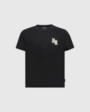The KIDS ELLIOT FRONT BACK GRAPHIC TEE by Psycho Bunny is a black Pima cotton shirt with a small white floral design on the upper left, featuring a water-based print for vibrant yet subtle graphics.
