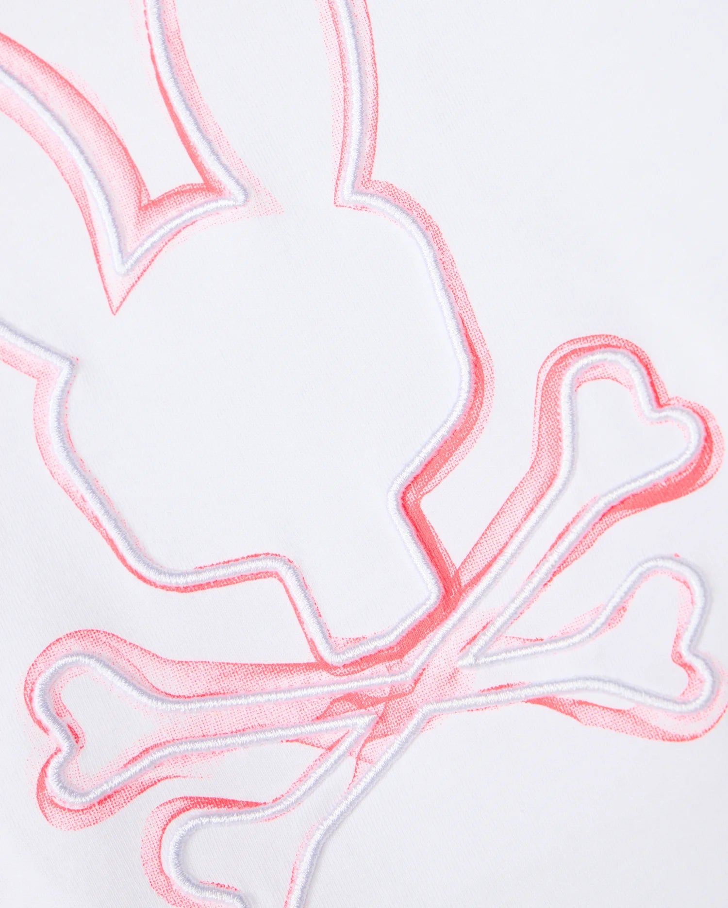Close-up of an embroidered design on white Pima cotton fabric, featuring an outline of a stylized bunny head with crossed bones underneath, reminiscent of a skull and crossbones motif. The stitching is primarily pink, adding a vibrant accent to the unfadable style of the Psycho Bunny KIDS VINCENT GRAPHIC TEE - B0U713D200.