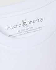 An up-close look at the neck label of the KIDS KINGSTON GRAPHIC TEE - B0U743D200, featuring the "Psycho Bunny" brand name next to a bunny with crossbones graphic. The label displays the size "10-12/M" and fabric information, emphasizing its premium 100% Pima cotton material, crafted in Peru.