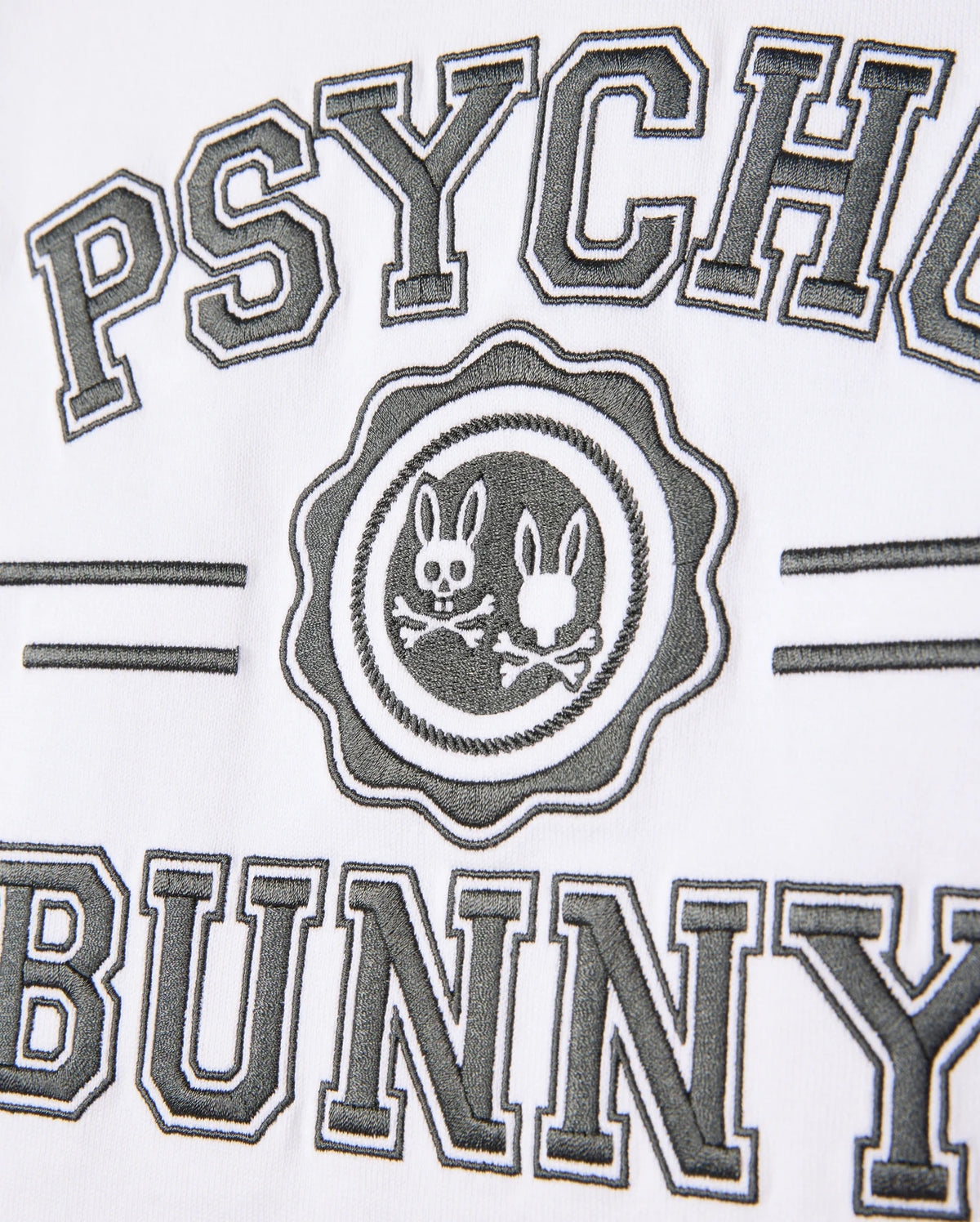The Psycho Bunny Official logo, featuring two bunny silhouettes inside a circle and encircled by the text "Psycho Bunny," is printed on luxurious pima cotton, similar to the high-quality designs on the Kids London Raglan Graphic Tee - B0U896D200.