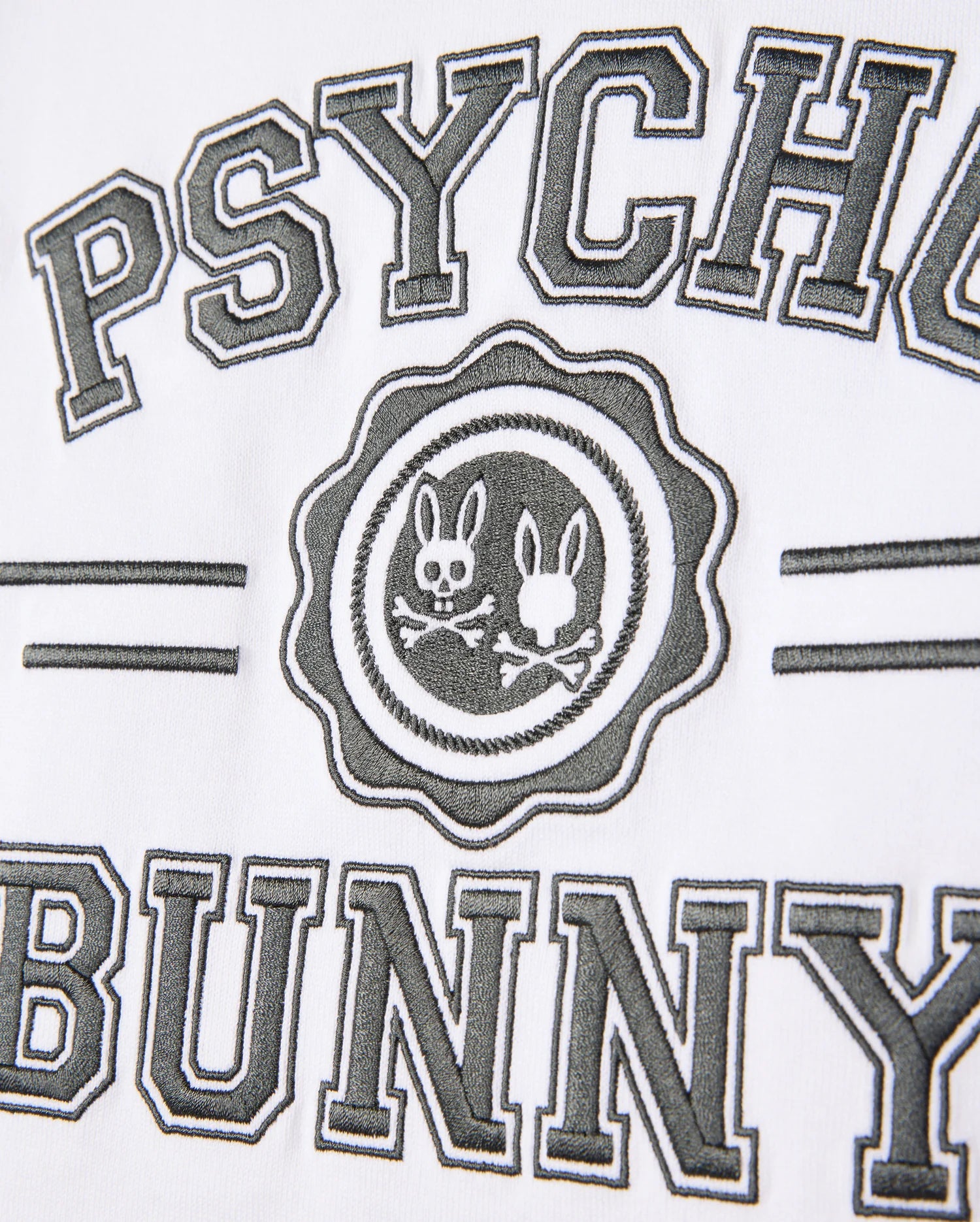 The Psycho Bunny Official logo, featuring two bunny silhouettes inside a circle and encircled by the text "Psycho Bunny," is printed on luxurious pima cotton, similar to the high-quality designs on the Kids London Raglan Graphic Tee - B0U896D200.