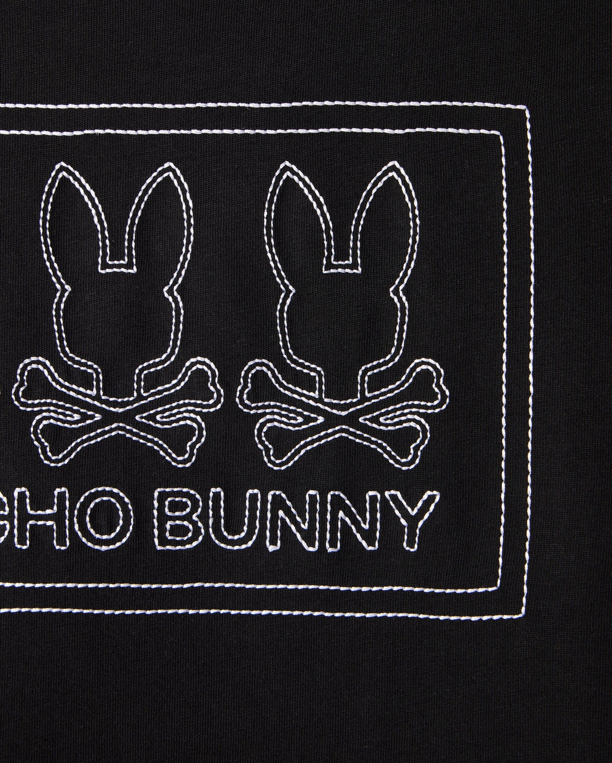 The KIDS TACOMA GRAPHIC TEE - B0U909D200 by Psycho Bunny features two outlined bunny heads with crossbones on a black background, with "PSYCHO BUNNY" embroidered in white below. Made from soft Pima cotton, the design is neatly enclosed within a rectangular stitched border.