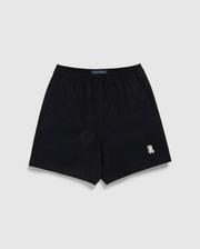 Black Psycho Bunny polyester mechanical stretch shorts with a drawstring waist and a small white logo on the left leg, displayed against a plain white background.