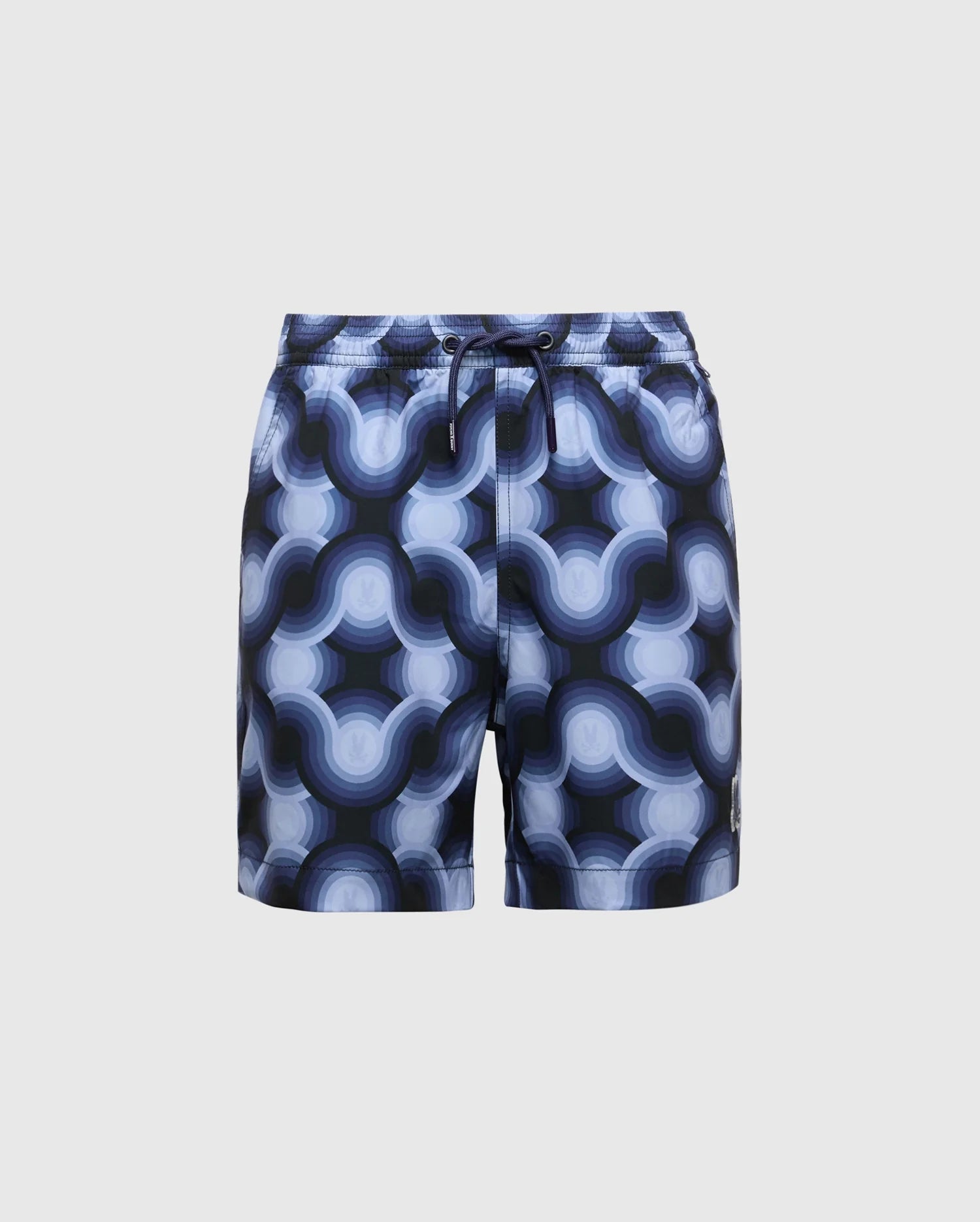 The KIDS PAROS PRINTED SWIM TRUNK - B0W450F200 by Psycho Bunny features a bold, geo-patterned design with interconnected blue and white circles. They include a comfortable drawstring waist set against a plain gray background.