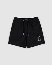 Black shorts featuring a white outline of a bunny with crossbones on the bottom right corner. Made from quick-dry material, these shorts have an elastic waistband with a black drawstring and two side pockets. Ideal for summer, the **KIDS PARKER HYDROCHROMIC SWIM TRUNK - B0W646C200** design by **Psycho Bunny** blends style and function against a light gray background.