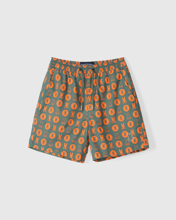 Green KIDS ARNOLD PRINT SWIM TRUNK by Psycho Bunny, featuring an orange bunny pattern and an elastic waistband. These versatile shorts are made from quick-dry material and include a stretch mesh lining for added comfort.