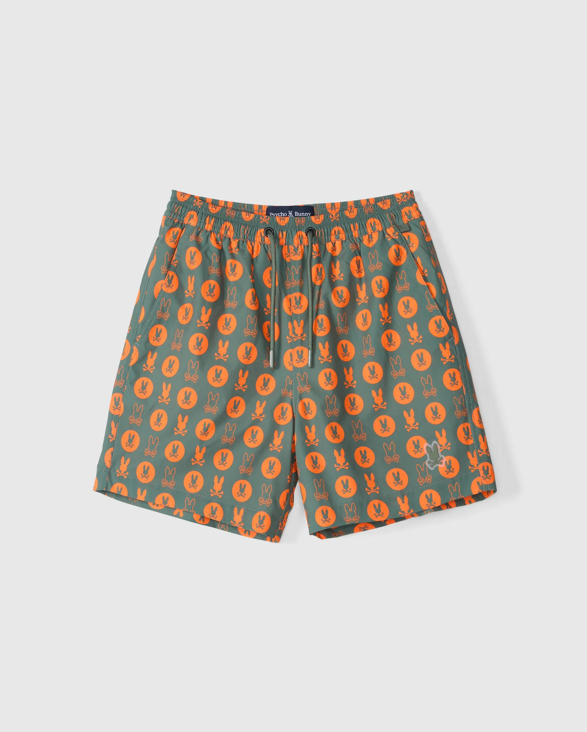 Green KIDS ARNOLD PRINT SWIM TRUNK by Psycho Bunny, featuring an orange bunny pattern and an elastic waistband. These versatile shorts are made from quick-dry material and include a stretch mesh lining for added comfort.