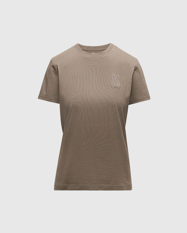 Introducing the WOMENS ALEXANDER GRAPHIC TEE by Psycho Bunny, a classic plain brown tee made from luxurious Pima cotton. It showcases a subtle Lurex embroidered bunny logo on the upper left side. Designed with a round neckline and short sleeves, this piece offers comfort and style with its light grey backdrop.