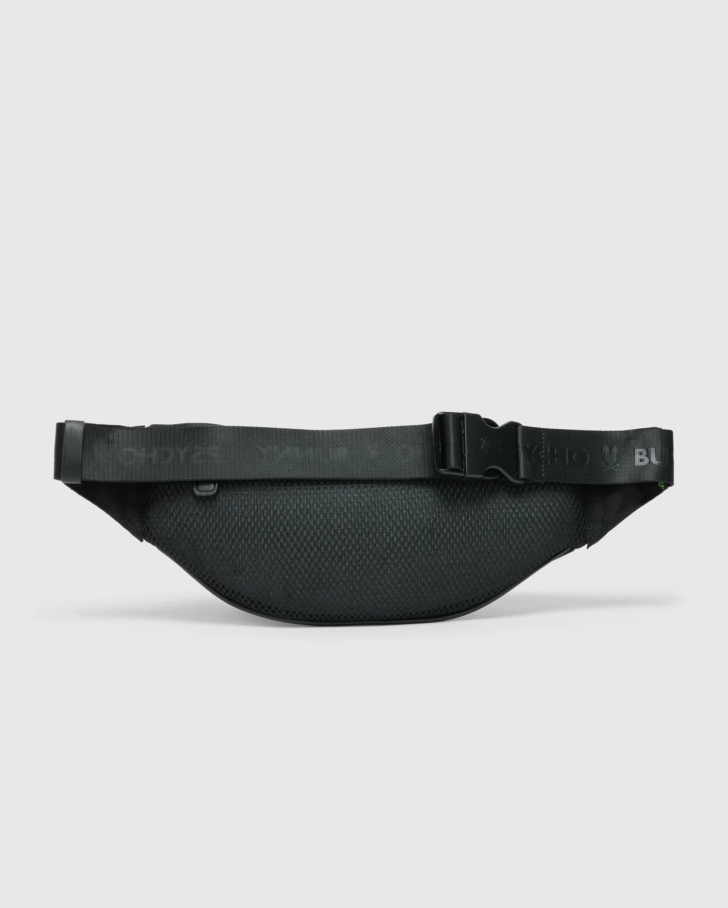The MENS CROSS BODY BAG - B6A181E200 by Psycho Bunny is a black waist bag with an adjustable strap and a sleek, minimalist design. This functional cross body bag features a buckle closure, and its textured pattern stands out against the plain white background.