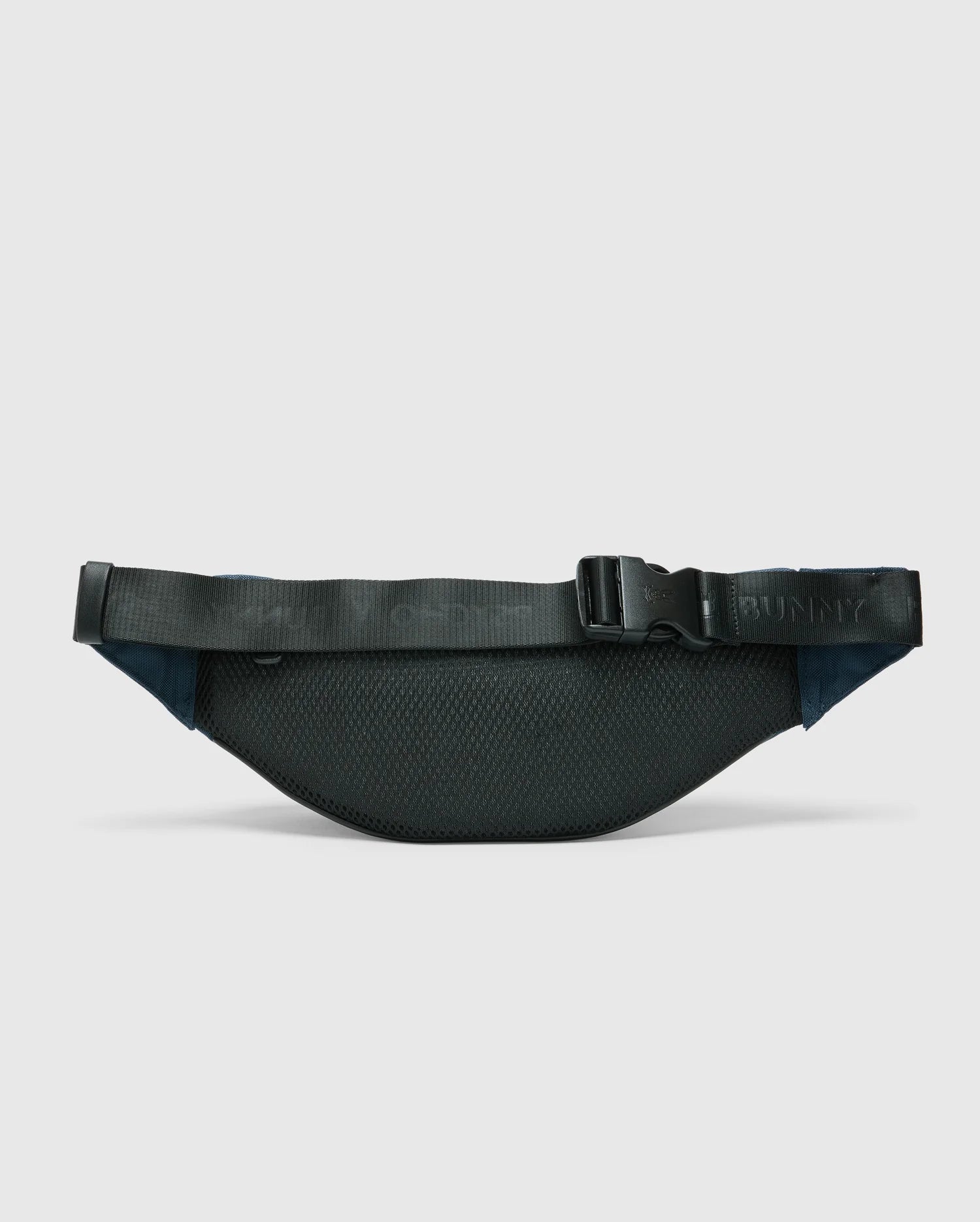 A black nylon MENS CROSS BODY BAG - B6A181E200 by Psycho Bunny features a textured surface with an adjustable strap and buckle. The functional waist bag is displayed against a light gray background.