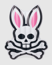 An inflatable pool floatie in the shape of a stylized rabbit's head with pink ears and a skull and crossbones design on the front, this Psycho Bunny POOL FLOATIE - B6A386B200 is primarily white with black accents. Perfect for your next resort vacation, it will make a fun and edgy statement in any pool setting.