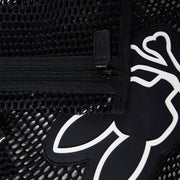 Close-up of a black mesh tote material with a zipper. The zipper pull tab is visible, alongside a black and white stylized graphic of a figure with outstretched arms and legs peeking through the mesh. The Psycho Bunny MENS MESH TOTE BAG - B6A388B200 features detachable zip pouch for added convenience.