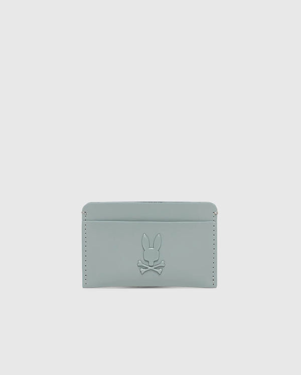 The "MENS RUBBERIZED CARD CASE - B6A473F200" by Psycho Bunny is a minimalist, light gray wallet featuring a subtle rabbit and crossbones embossment and edge stitch details for secure storage.