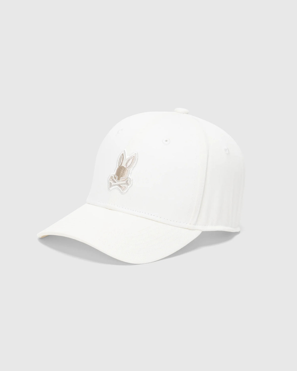 The Psycho Bunny MENS NEW CASTLE GRAPHIC BASEBALL CAP - B6A547F200, with a light brown rabbit embroidered on white cotton twill, exudes quiet luxury. Its slightly curved brim stands out artfully against a plain gray background.