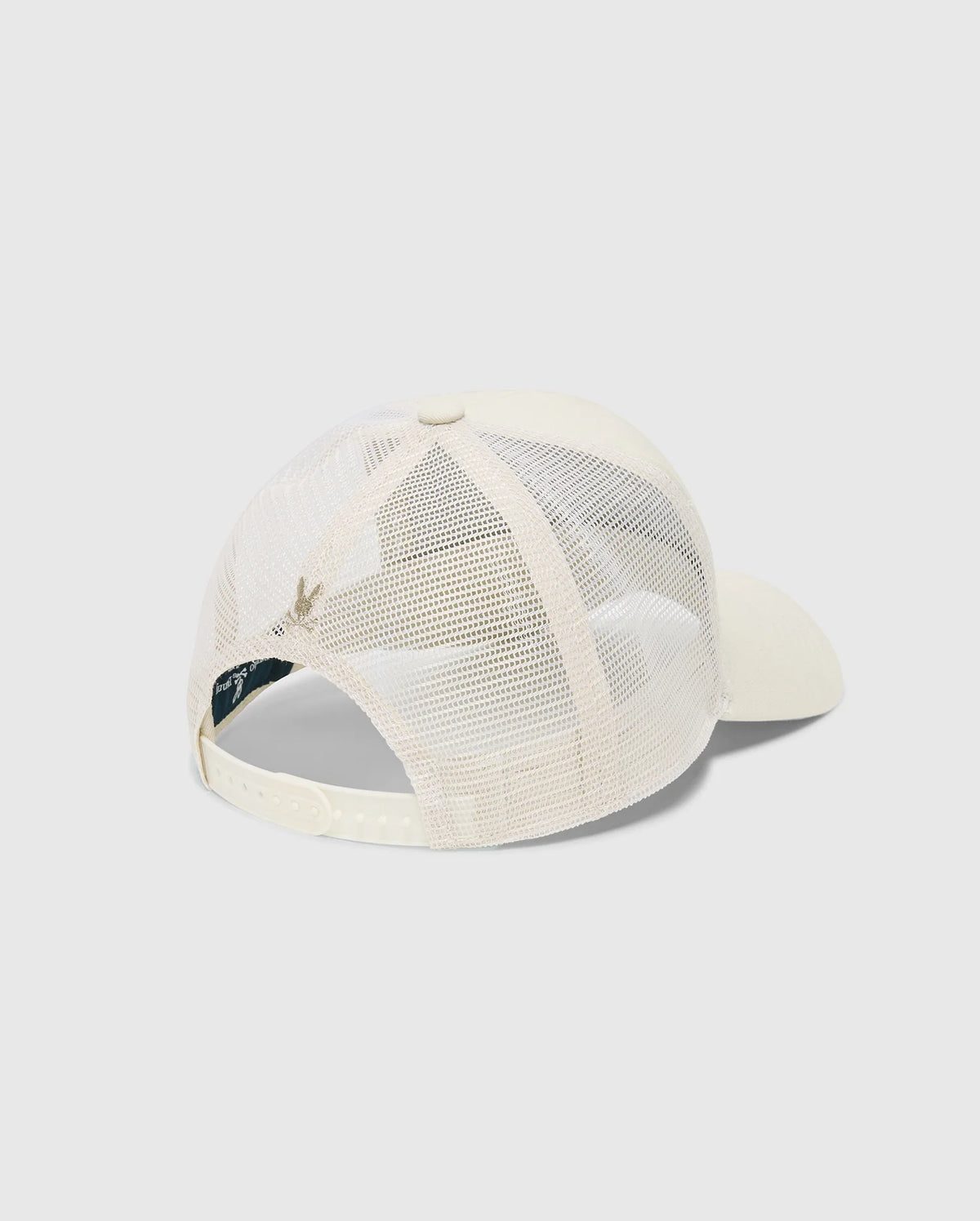 The rear of the Psycho Bunny Men's Melbourne Graphic Trucker Hat (B6A548F200) in beige, with a mesh back and snap-back strap, is displayed against a light gray background. The front, showcasing an embroidered icon, remains hidden.