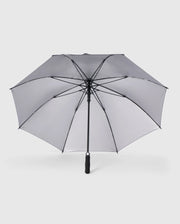 A large, open GOLF UMBRELLA - B6A624C200 from the Psycho Bunny brand features a collapsible design with a black frame and gray canopy. This dependable umbrella has a central black pole and handle, with clearly visible spokes set against a plain white background.