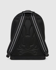 A black DOME BACKPACK - B6A628Z1BP by Psycho Bunny featuring a mesh design with a reflective Batman logo and reflective stripes on the shoulder straps, against a solid gray background.
